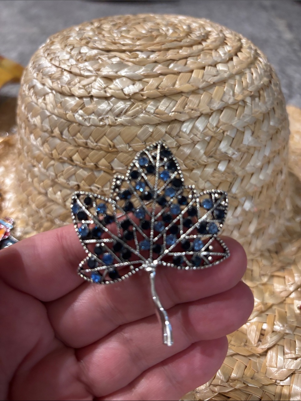 Leaf with blue and black stones.